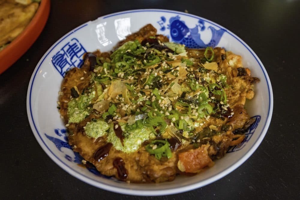 An okonomiyaki pancake prepared by Mei and Irene Li. (Jesse Costa/WBUR)