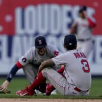 Boston Red Sox second baseman Jonathan Arauz (3) sits on the field after missing the walk-off single hit by New York Yankees' Josh Donaldson in the 11th inning of an opening day baseball game, Friday, April 8, 2022, in New York. (John Minchillo/AP)