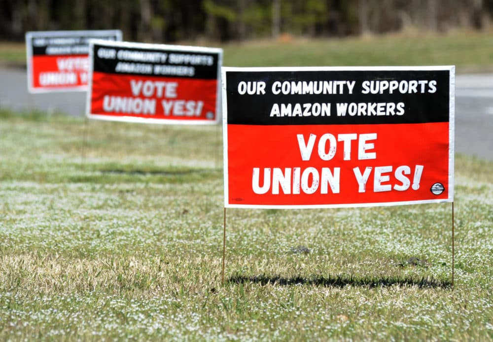 Signs supporting the Retail, Wholesale and Department Store Union are shown near an Amazon fulfillment center in Bessemer, Alabama, on Thursday, March 10, 2022. (Jay Reeves/AP)