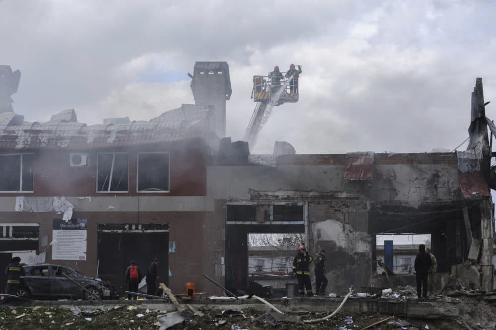 Firefighters work to extinguish a fire after an airstrike hit a tire shop in Lviv, Ukraine, Monday, April 18, 2022. (Mykola Tys/AP)