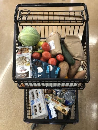 A shopping cart filled with plastic-free foods. (Courtesy Martha Bebinger)