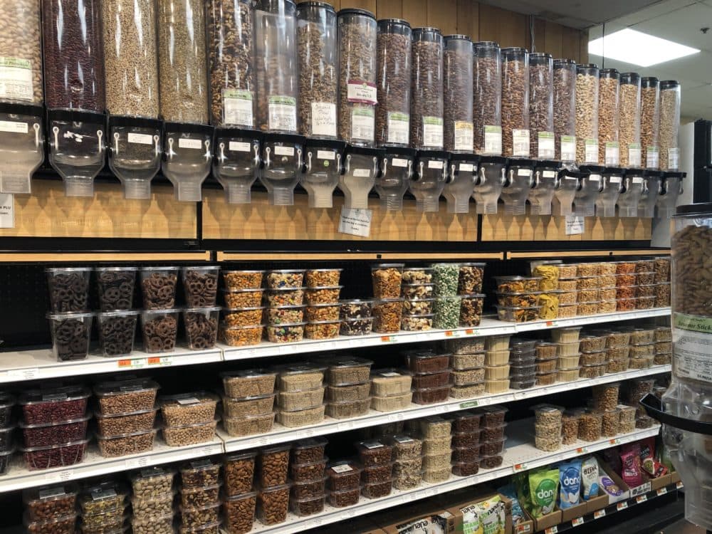Nuts and dried fruit items at a grocery store. (Martha Bebinger/WBUR)