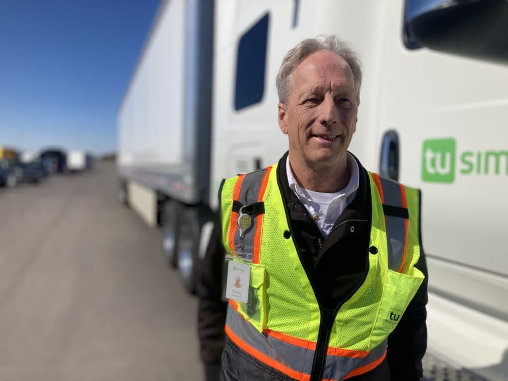 Randy Redwine has been a trucker for decades. When the TuSimple trucks are doing autonomous runs on the interstate, Redwine sits in the driver’s seat to take over the controls in case emergency. (Peter O'Dowd/Here & Now)