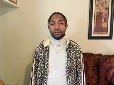 Robinson Lalin's nephew, Kelvin Lalin, inside his mother's home in Grove Hall. (Darryl C. Murphy/WBUR)