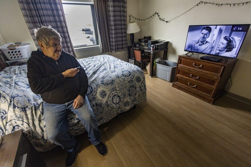 Ray Allen Gaessler in his unit at Roadway Apartments, permanent supportive housing developed and run by Father Bill's & MainSpring in the former Rodeway Inn in Brockton. (Jesse Costa/WBUR)