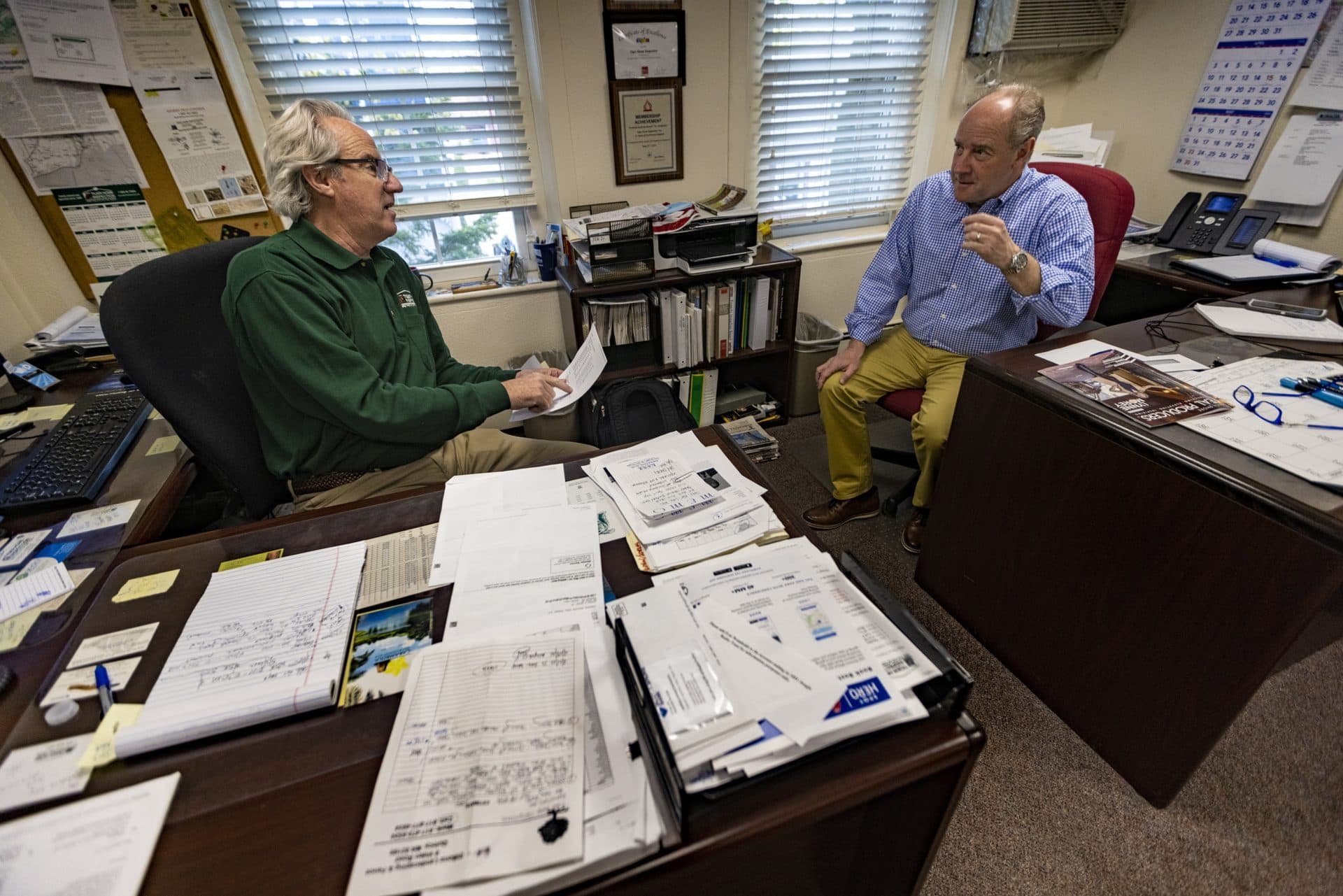 Jay Rizzo (left) and Sean Rizzo at the office of Tiger Home Inspection in Braintree. (Jesse Costa/WBUR)