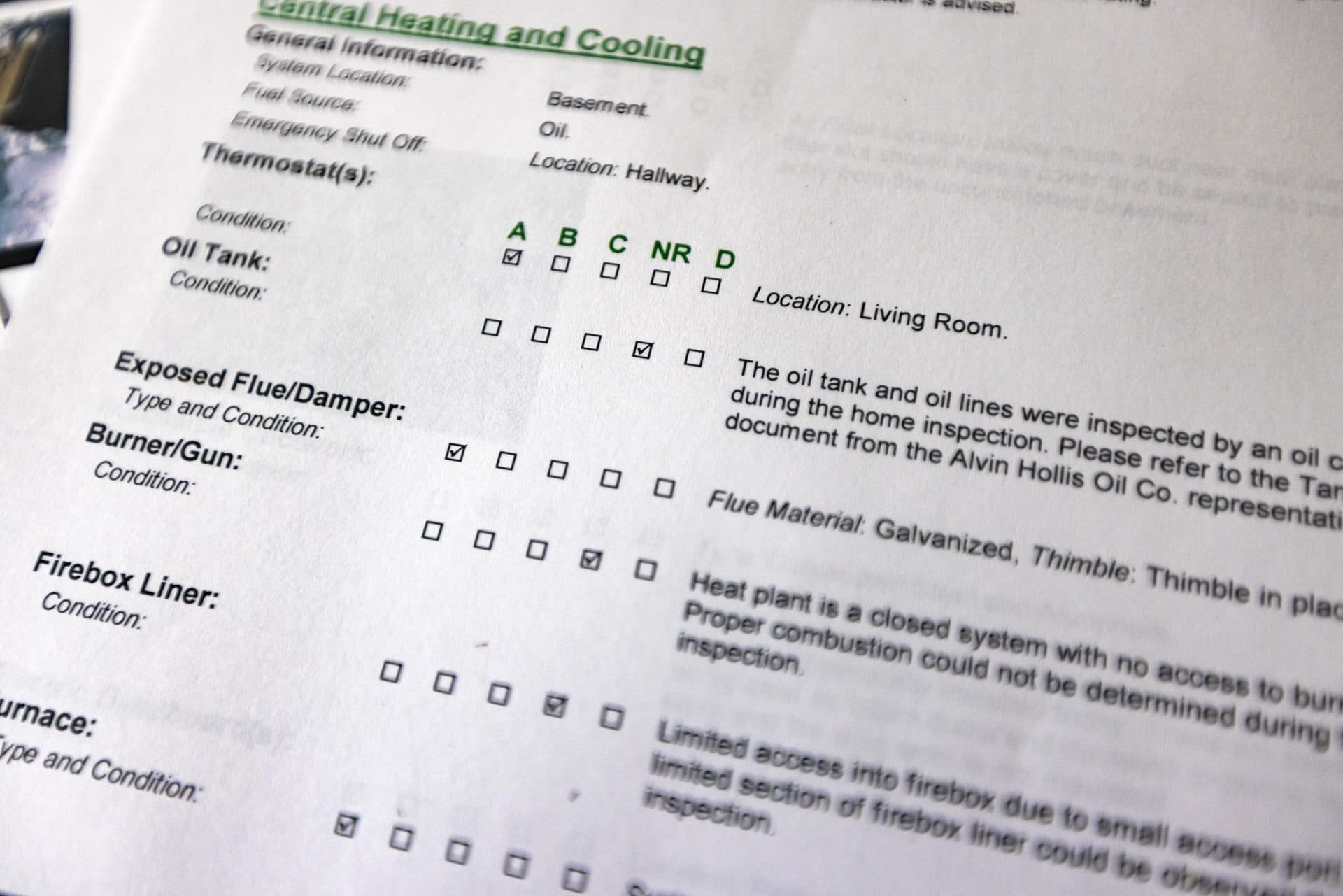 Each report produced by Tiger Home Inspection contains a checklist of items inspected with a grade. (Jesse Costa/WBUR)