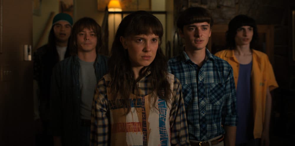 From left to right, Eduardo Franco as Argyle, Charlie Heaton as Jonathan, Millie Bobby Brown as Eleven, Noah Schnapp as Will Byers, and Finn Wolfhard as Mike Wheeler in "Stranger Things." (Courtesy of Netflix © 2022)