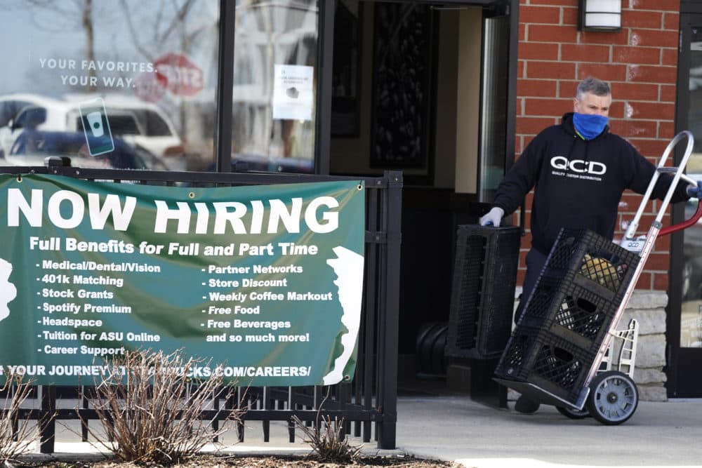 FILE - A hiring sign is displayed outside of a Starbucks in Schaumburg, Ill., Friday, April 1, 2022. (Nam Y. Huh/AP)