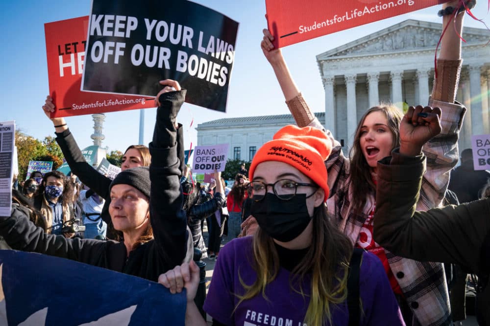Pro-life and pro-choice protestors gather outside the Supreme Court as arguments begin about the Texas abortion law by the court on Capitol Hill on Monday, Nov. 01, 2021 in Washington, DC. (Jabin Botsford/The Washington Post via Getty Images)