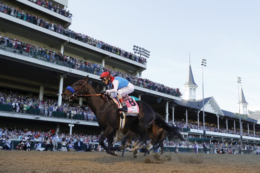 At last year's the Kentucky Derby, Medina Spirit #8, ridden by jockey John Velazquez crosses the finish line to win at Churchill Downs on May 01, 2021 in Louisville, Kentucky. (Tim Nwachukwu/Getty Images)