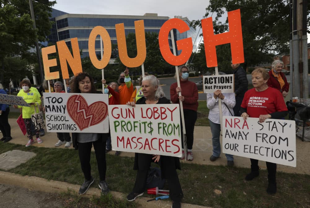 Gun-control advocates hold a vigil outside of the National Rifle Association (NRA) headquarters following the recent mass shooting at Robb Elementary School on May 25, 2022 in Fairfax, Virginia. (Kevin Dietsch/Getty Images)