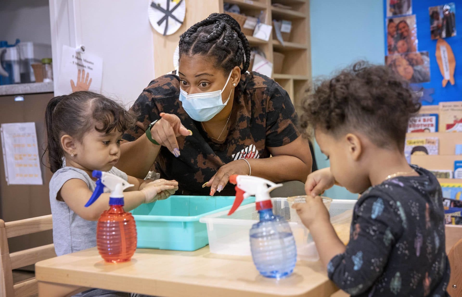 Teacher Brandy Miracle plays with kids at Horizons for Homeless Children.  (Robin Lubbock/WBUR)