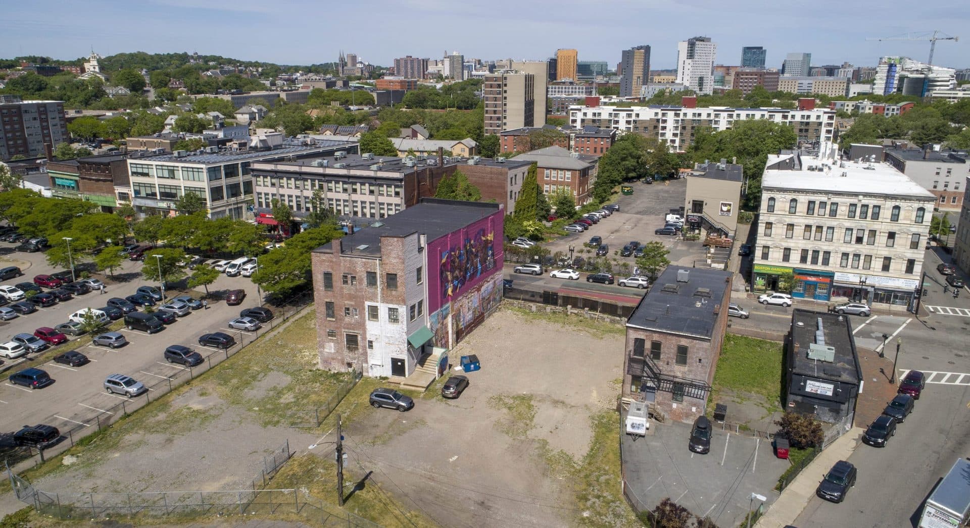 The planned Nubian Square Ascends and 2147 Washington Street developments will cover the Blair parking lot on the left, the open area in the center, and the car park on the far side of Washington Street. (Robin Lubbock/WBUR)