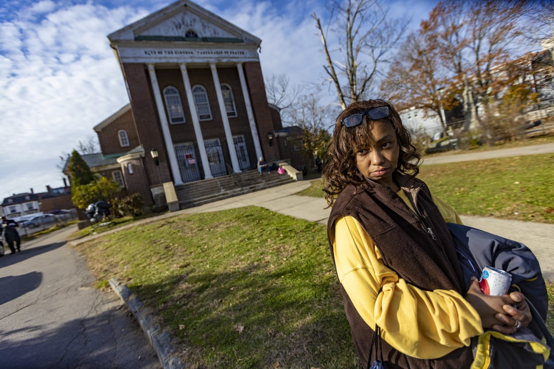 Michelle, a singer, considers joining the choir at Universal Missionary Church near Perkins Park. (Jesse Costa/WBUR)