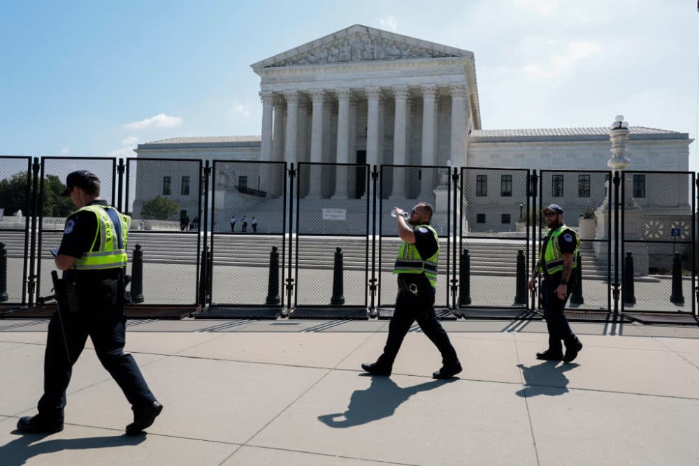 U.S. Capitol Police Officers walk in front of the U.S. Supreme Court Building on June 13, 2022 in Washington, DC. The court continues to release opinions as the country awaits major case decisions pertaining to abortion rights, guns, religion and climate change in the the coming weeks before the end of their term. (Anna Moneymaker/Getty Images)